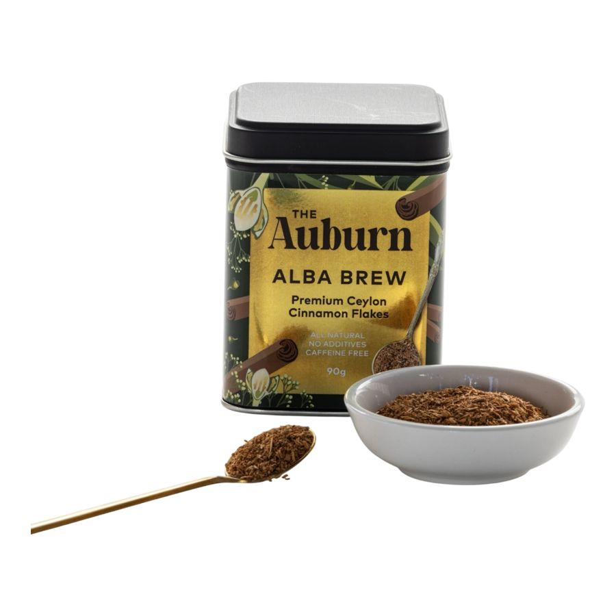 Alba Brew tin with a bowl and gold spoon of Ceylon Cinnamon flakes