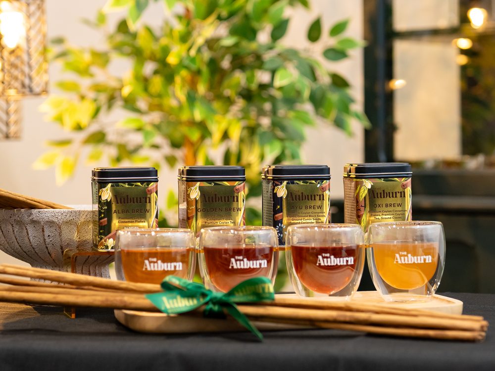 Four Auburn brews served in glasses at a café