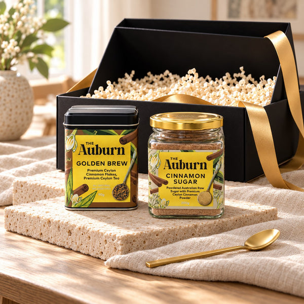 Sweet Start hamper: a Golden Brew tin, a jar of cinnamon sugar and a gold tea spoon.