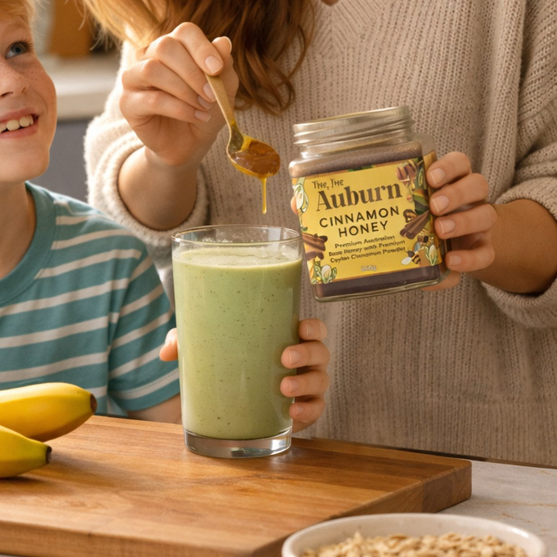 Cinnamon Honey being spooned into a smoothie