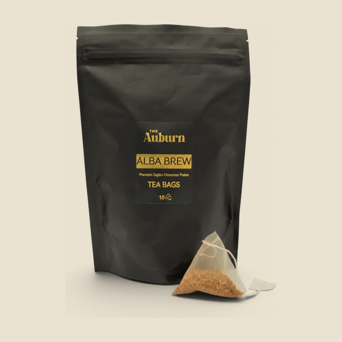 Alba Brew tea bag pouch with a pyramid bag of cinnamon flakes in front